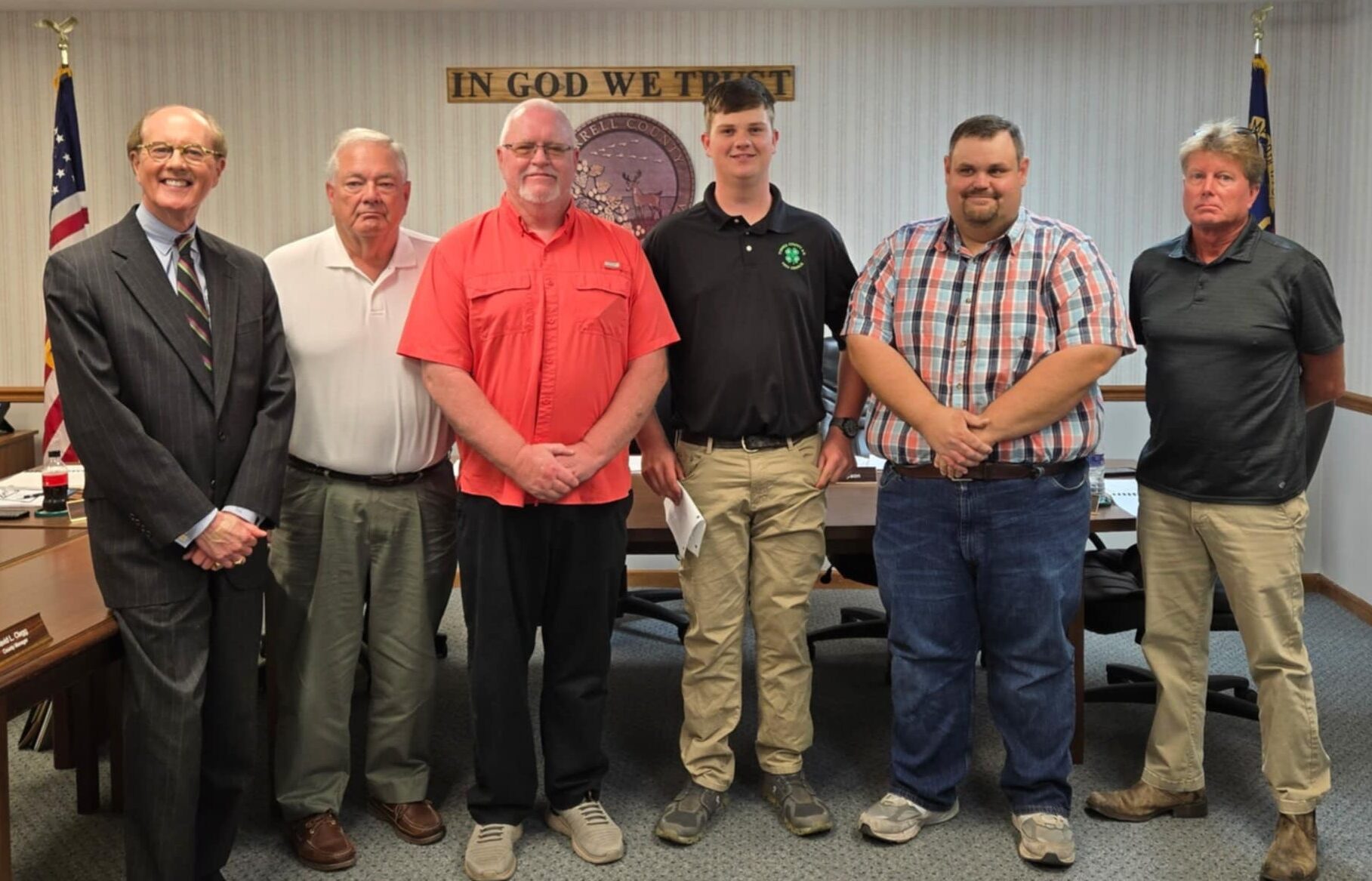 4-H'er pictured with the Tyrrell County Commissioners.